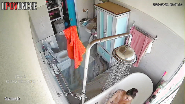 Brunette MILF with curvy shapes takes a bath and masturbates