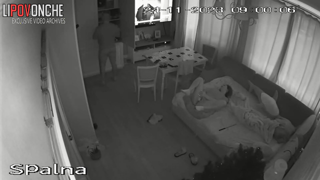 Brunette fucked by man in living room in front of TV