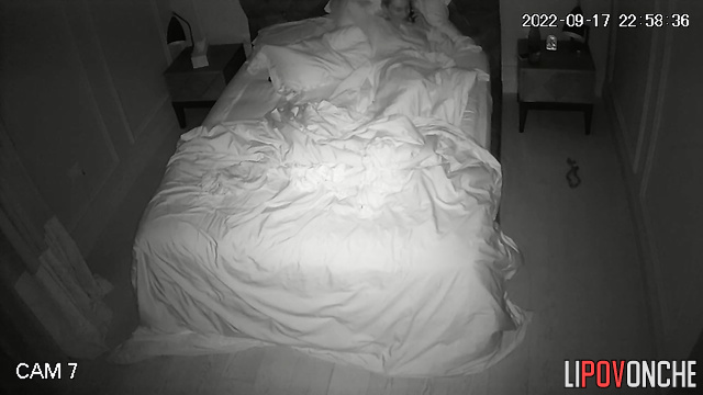 Skinny blonde with big tits has phone sex on bed in bedroom
