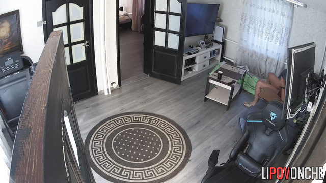 Man jerks off in living room in front of TV to homemade porn