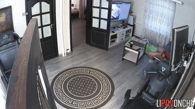 Man jerks off in living room in front of TV to homemade porn