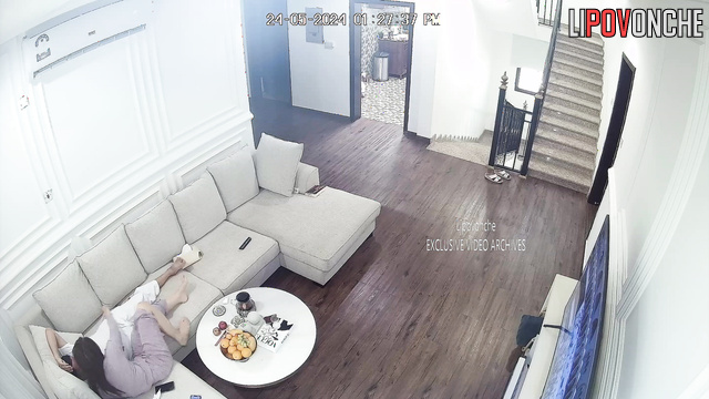 Brunette in pajamas sucks a man's cock in the living room