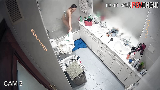 Sexy brunette with beautiful breasts takes a shower
