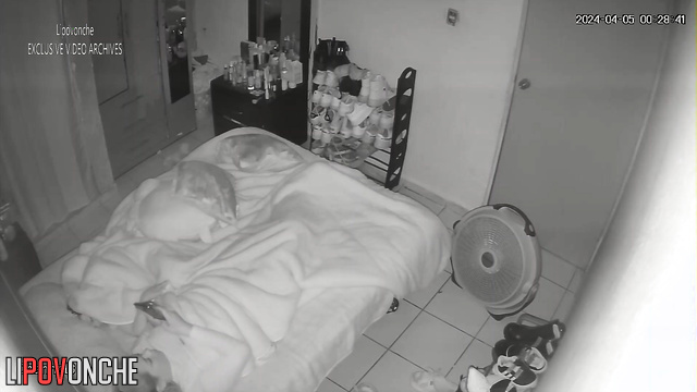 Babe having fun with her clit under sheets (night tape)