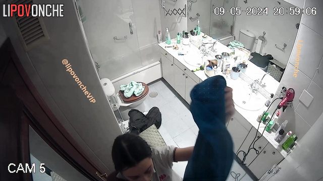 Cute brunette taking shower after dissolute party