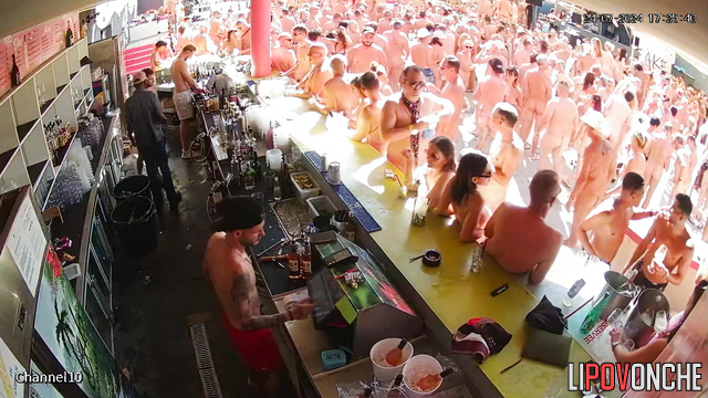 Swinger party with drinks, dancing and blowjobs near the bar