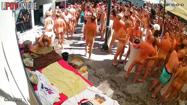 Crowd of people having fun and fucking at a swingers party
