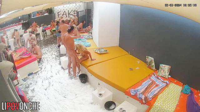 Black and white people taking part in adult party (sex in pool)