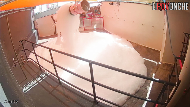 People kissing right in the foam (swinger pool party)