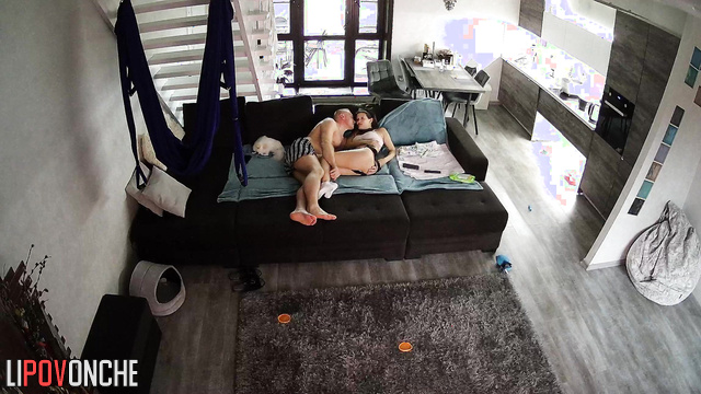 Couple kissing on the huge sofa - watch this cool video