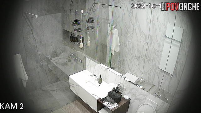 A loving couple takes turns taking a shower in the bathroom