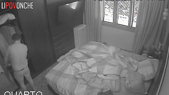 Cute couple kissing and being affectionate on bed in bedroom
