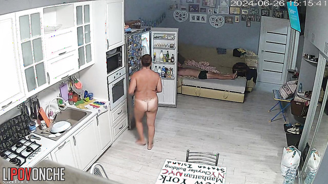 Naked milf preparing dinner with an oven (kitchen video)