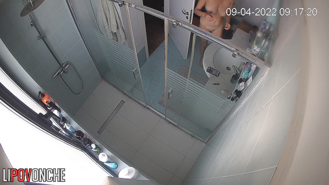 The naked brunette sat on the toilet with the phone for a long time