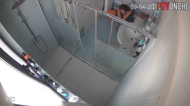 The naked brunette sat on the toilet with the phone for a long time
