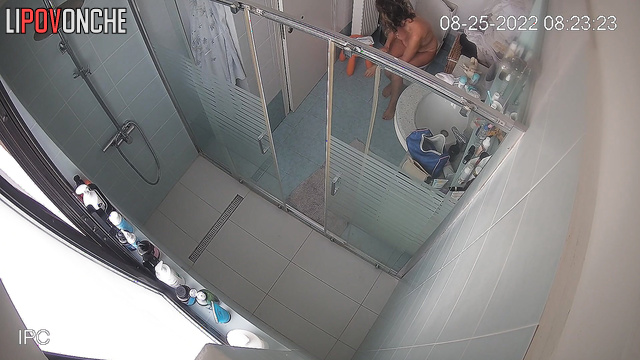 Brunette uses the toilet in the bathroom and takes care of herself