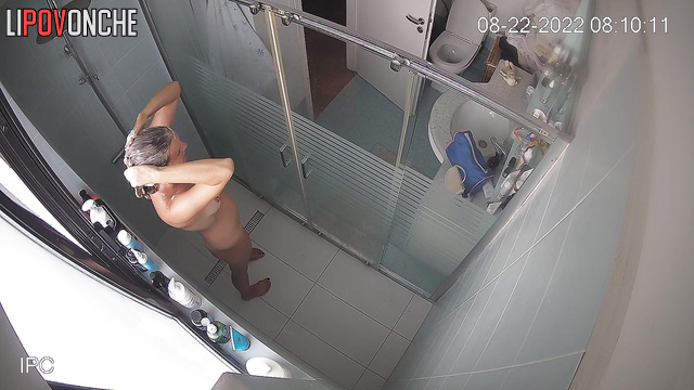 Blonde washing her awesome natural tits (hidden cam)
