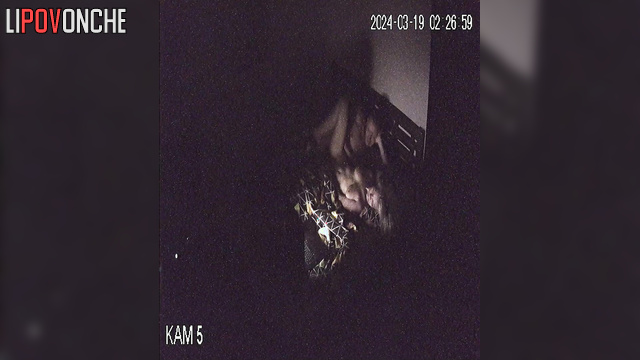Couple watching TV and fucking on bed in the dark.