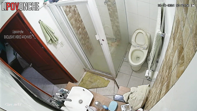 Brunette shaves in the bathroom and takes a shower