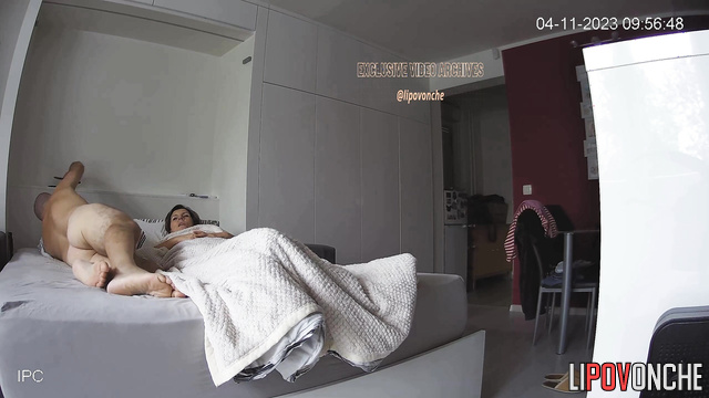 Adult couple celebrating wedding anniversary in bed