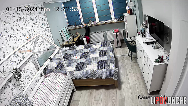 Long-haired brunette dressing and wants being spied