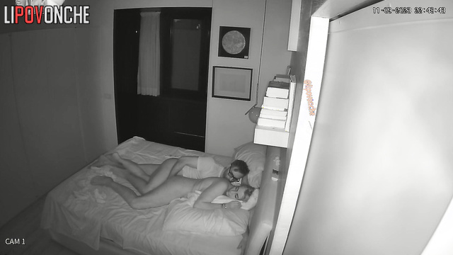 Man watching tv and teasing her at the same time