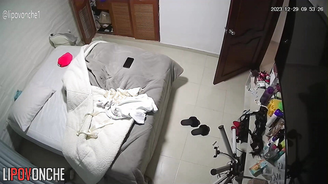 A lush brunette changes her clothes without paying attention to the maid