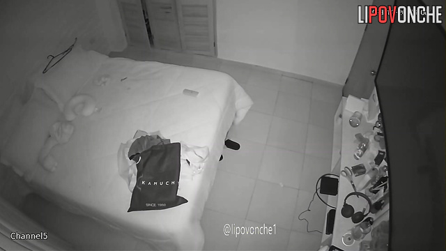 A big-breasted woman completely undresses before going to bed