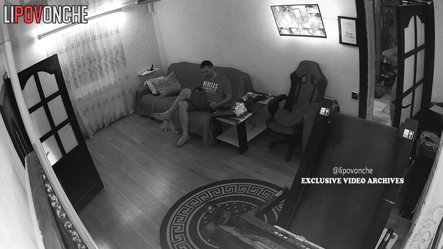 She sitting naked on her knees next to him, spy cam