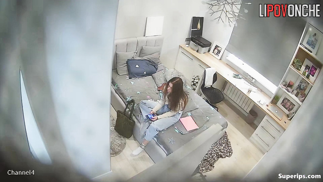 Teenage girl changing clothes in the closed bedroom