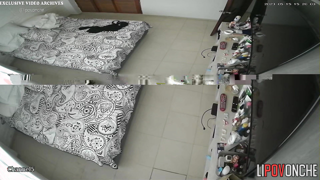 Tattooed couple chilling with phones on the bed