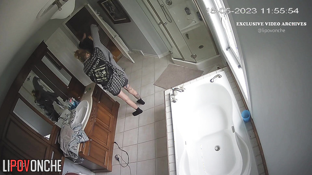 Tattooed bestie cutting hair her blondy, bathroom tape