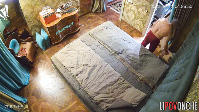 Redhead lady and gray-haired guy having hot conversation on the bed
