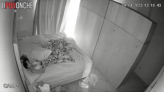 Sad brunette in white underwear chilling on the bed