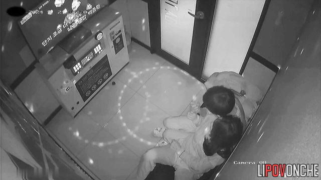 Asian couple kissing tenderly in a karaoke club