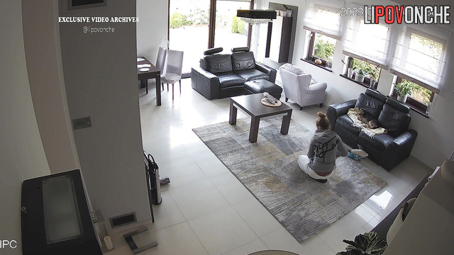 Blonde playing with her best friend in the living room