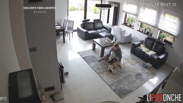 Blonde playing with her best friend in the living room