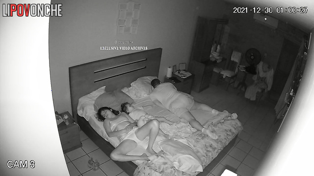 Close relatives chilling together on the bed in the morning
