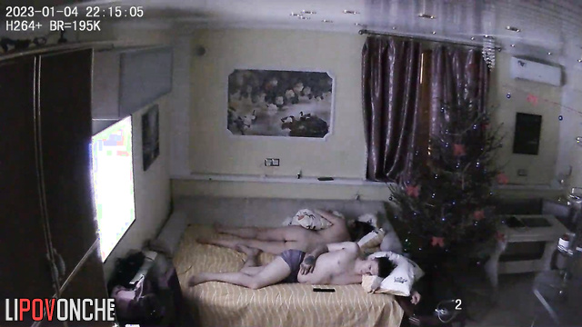Couple sleeping together after New Year's Eve