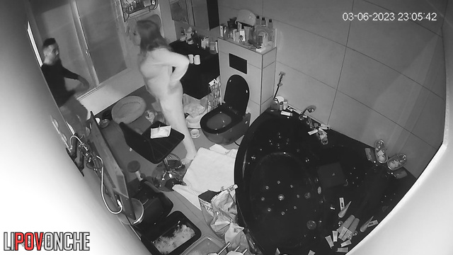 Blonde sitting on the toilet and chatting with brother