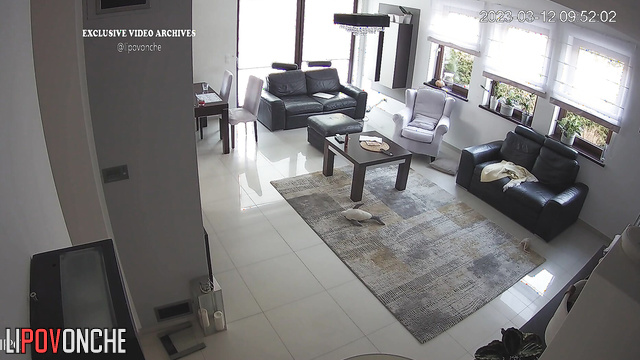 Lonely sexy blonde eating ih her huge empty living room