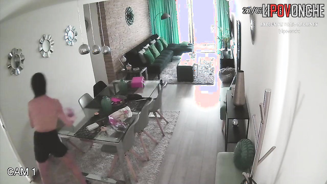 Naked brunette is bored in the living room, watch