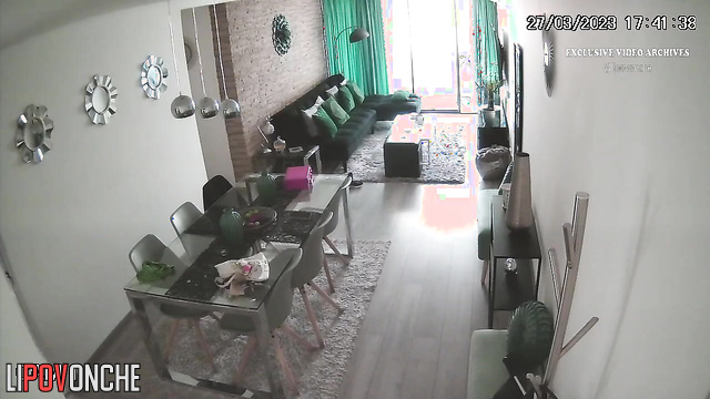 Naked brunette is bored in the living room, watch