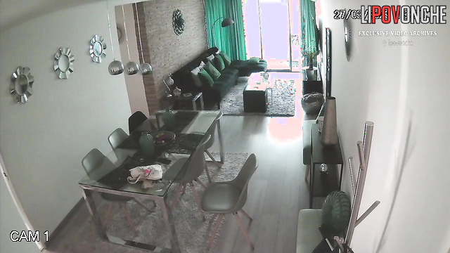Naked brunette is bored in the living room, watch