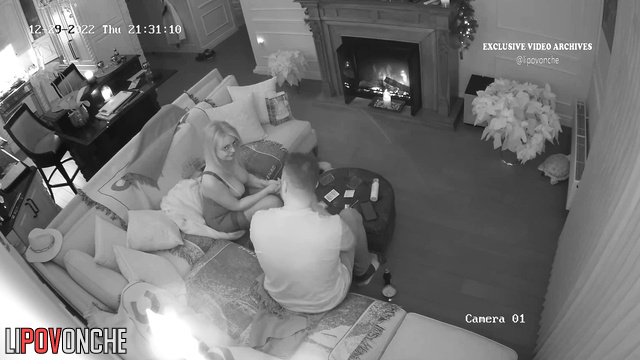 Couple having time on the floor (near the fireplace)