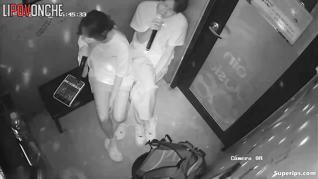 Asian couple having fun in the karaoke club right now