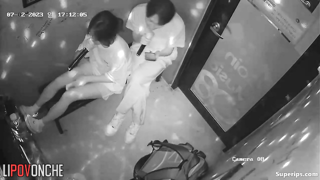 Asian couple having fun in the karaoke club right now