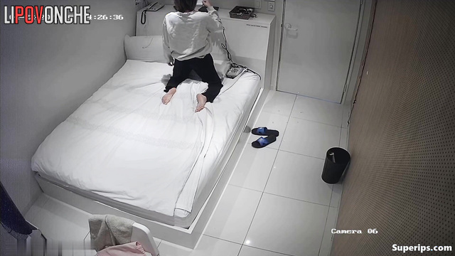 Asian girl drying her hair (and being watched)