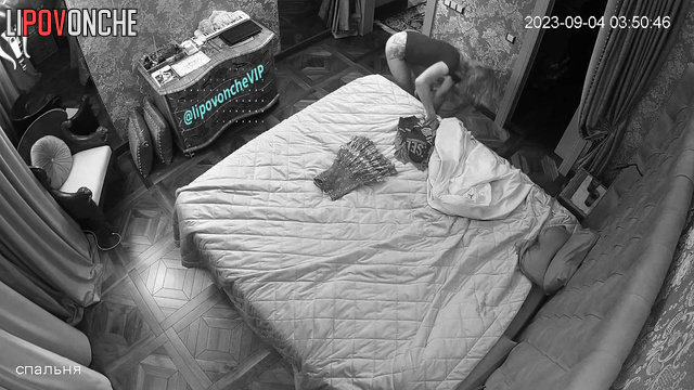 Naked couple reading books together - bedroom scene