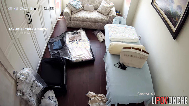 Blonde unpacking her clothes after an exotic trip